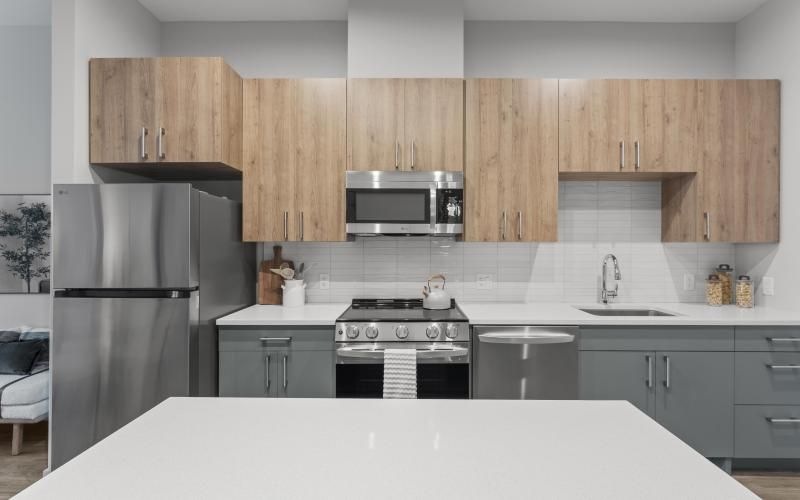 a kitchen with wooden cabinets