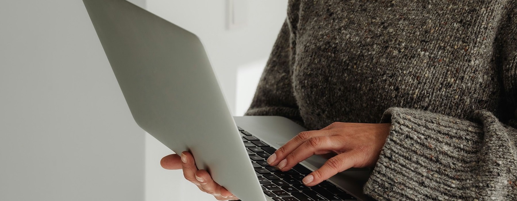 a person typing on a laptop