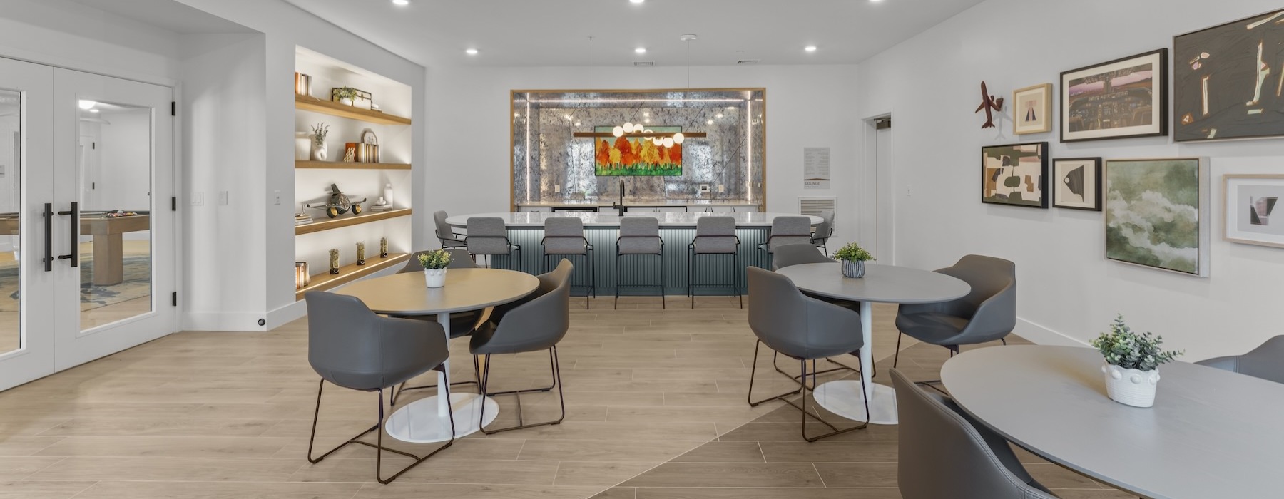 a clubroom with tables and chairs