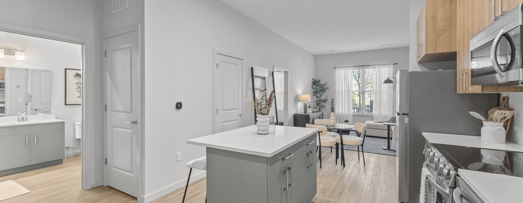 a kitchen with an island and chairs