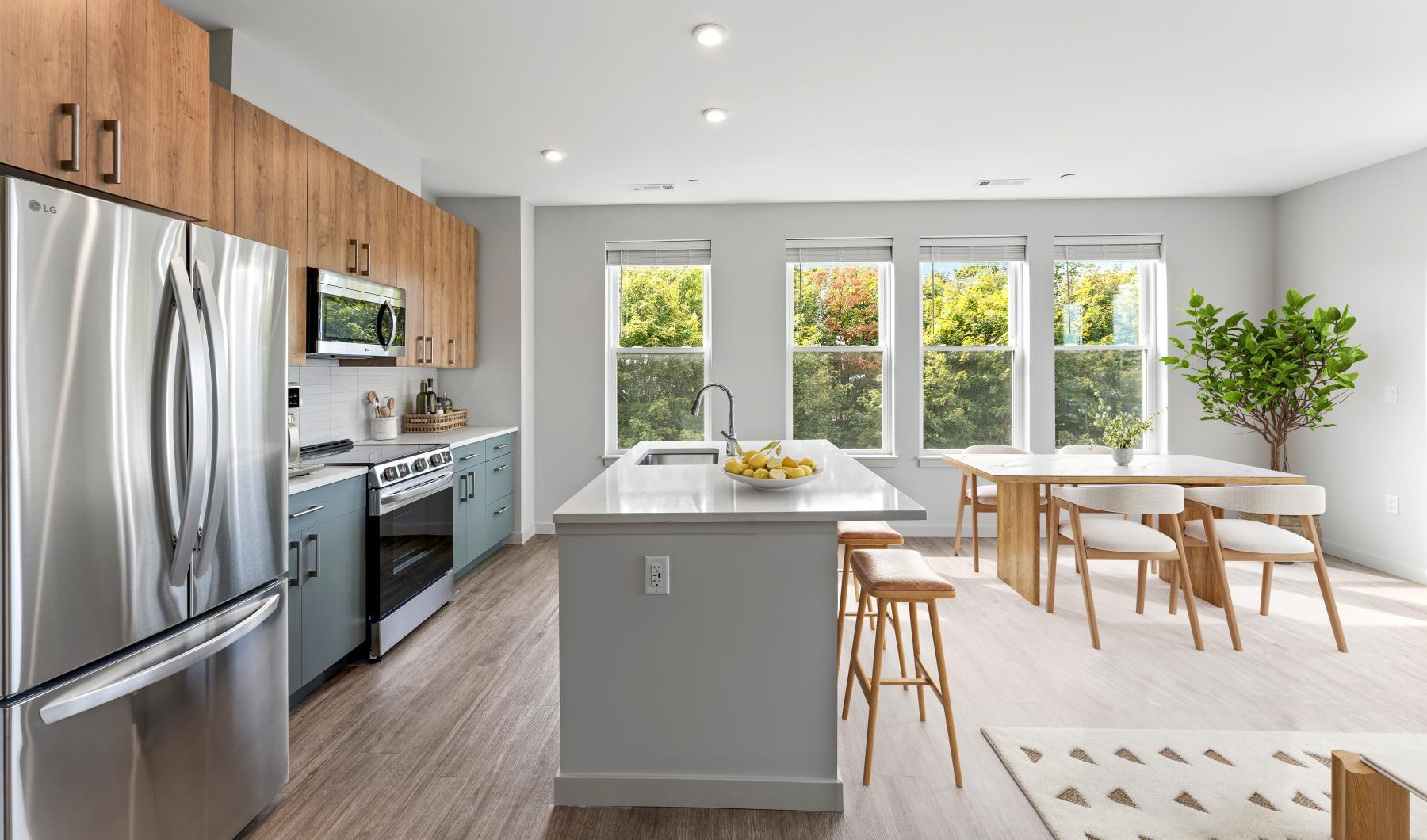 a kitchen with a table and chairs